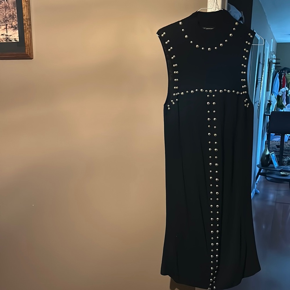 Lovely black dress with silver detail for any occasion.